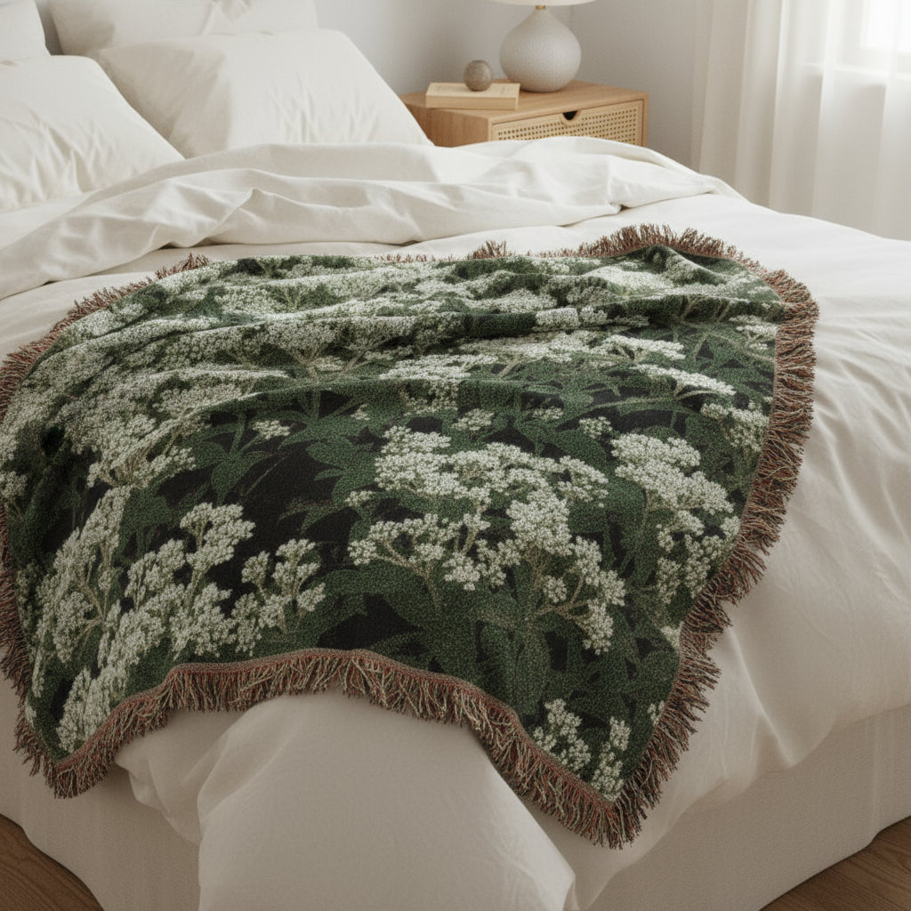 Large woven blanket with a floral pattern on a white background