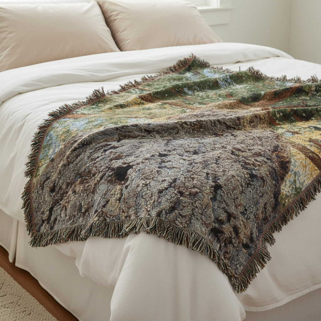 Woven blanket with a tree design on a white background