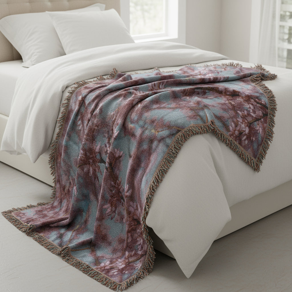 Woven blanket with floral design on a white background